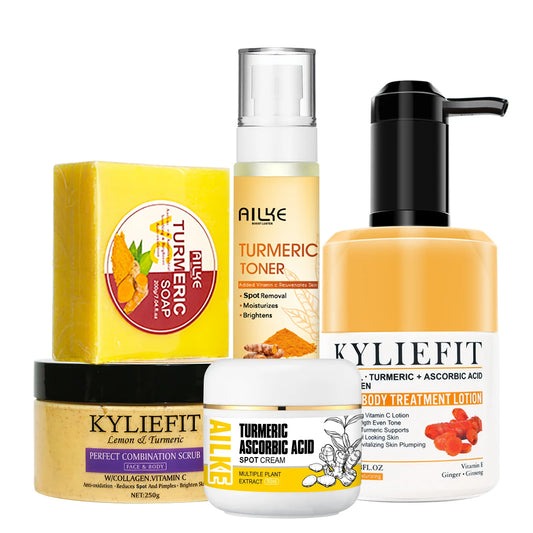 A group of skincare products is displayed, including a turmeric soap, a turmeric toner, a turmeric and ascorbic acid body treatment lotion, a lemon and turmeric scrub, and a turmeric ascorbic acid spot cream. Branded as either "KylieFit" or "AILIKE," these natural ingredients promise glowing skin and a radiant complexion.